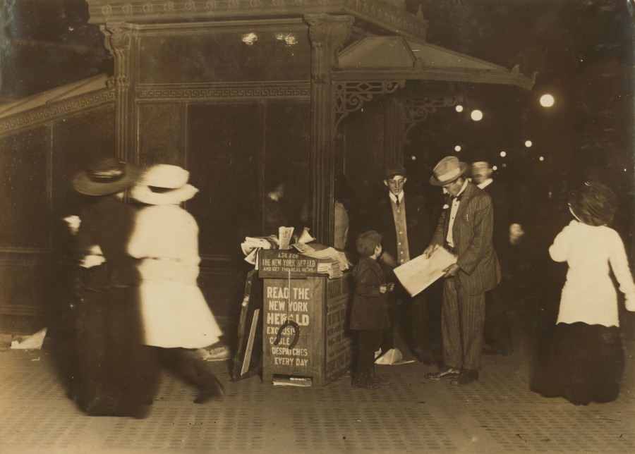Jerald Schaitberger of 416 W. 57th St. N.Y. helps his older brother sell papers until 10 P.M. on Columbus Circle. 7 yrs. old. 9:30 P.M., October 8, 1910. Photo by Paul B. Schumm / Library of Congress