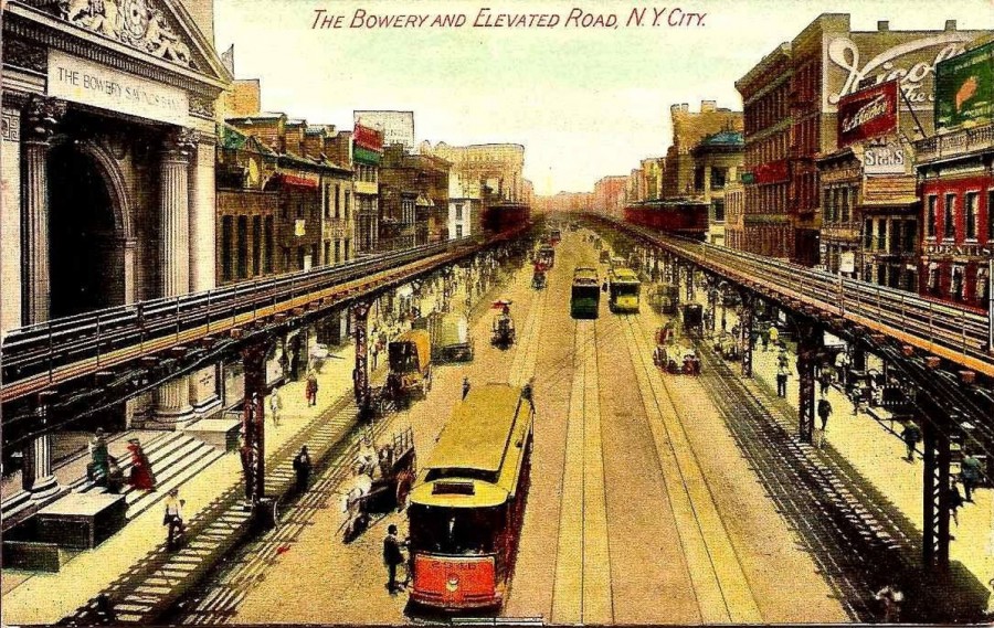 The Third Avenue Elevated at the Bowery. The Bowery Savings Bank Building is on the left.