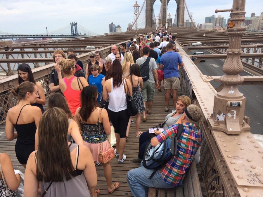 The Brooklyn Bridge pedestrian walkway is always crowded. photo via christiangood.net